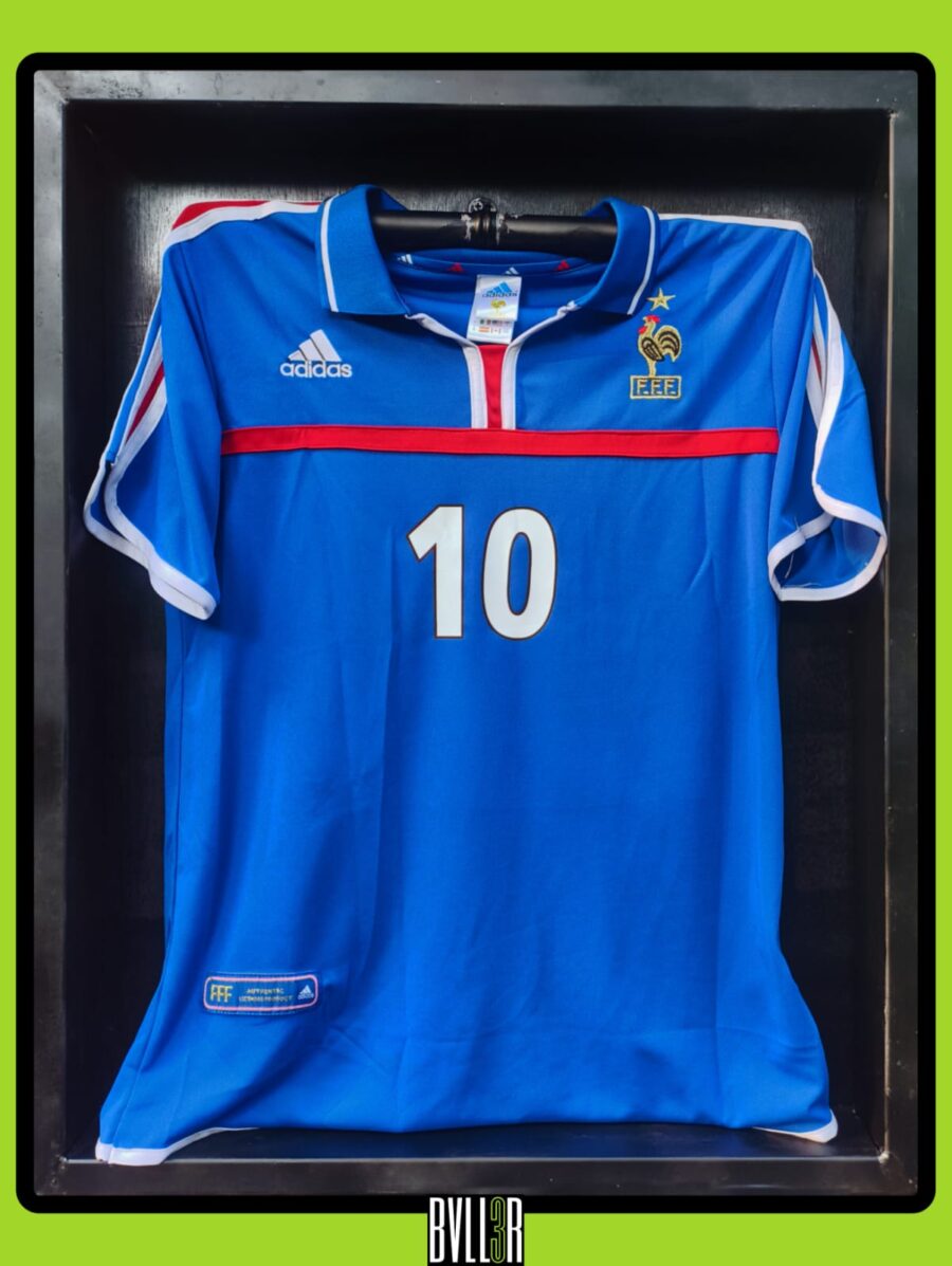 Zinedine Zidane France EURO 2000 kit displayed in BVLL3R case, with hologram upload featuring his highlights from the tournament—dribbles, passes, and set-piece brilliance.