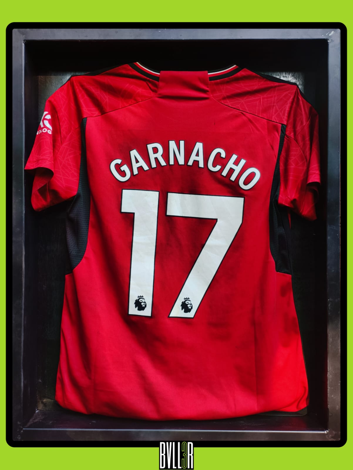 Alejandro Garnacho 2023/24 Manchester United kit in BVLL3R’s acrylic display, featuring hologram upload of full season highlights and bicycle kick at Everton. Slightly worn condition adds character.